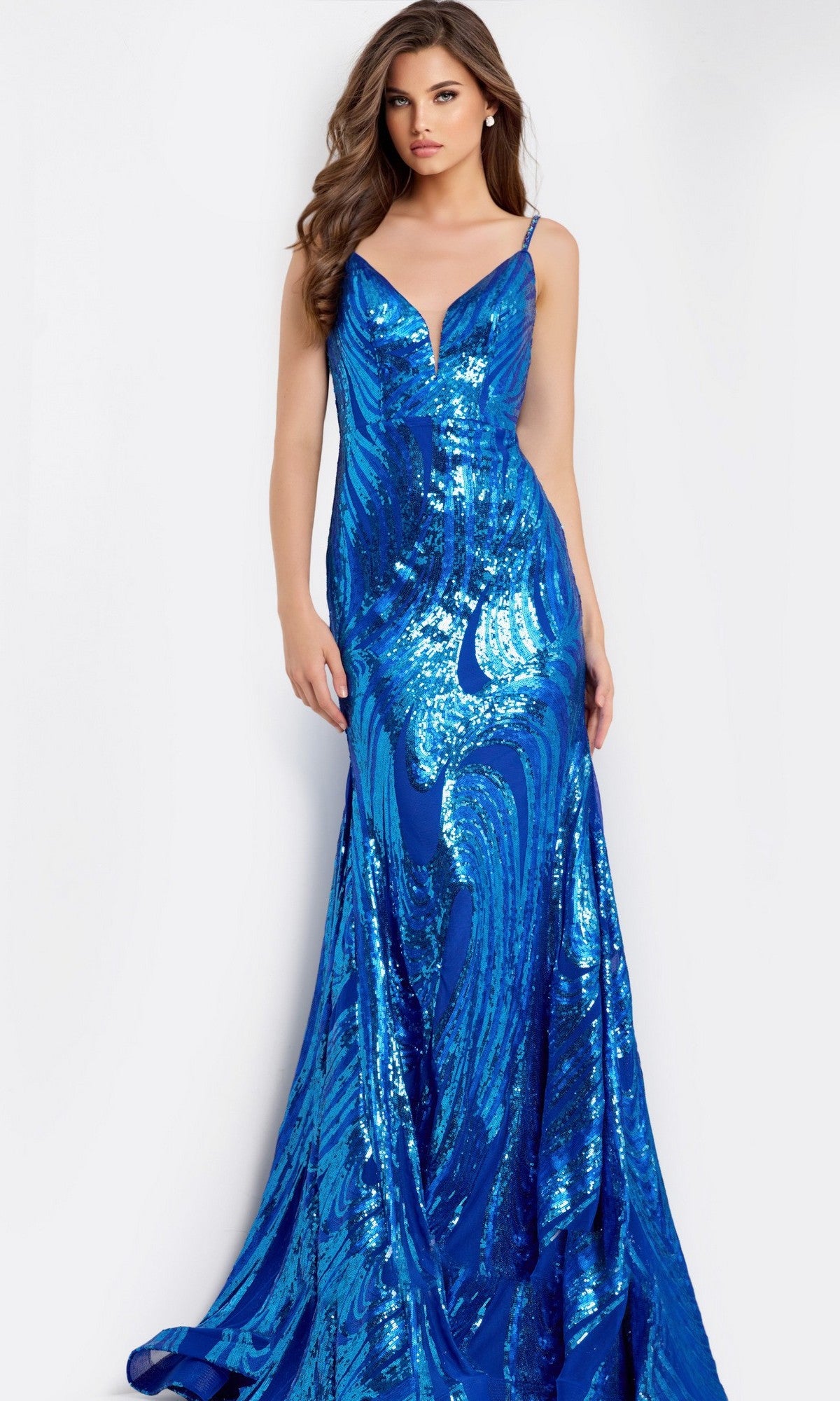 A woman models the Jovani 48518 long prom dress in cobalt, featuring a fitted silhouette, sequin details, thin straps, and a deep V neckline against a plain background.